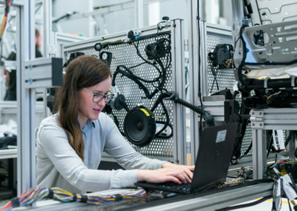 Woman Working On Audio Equipment