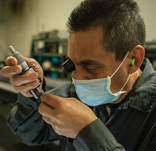 male worker with precision tools